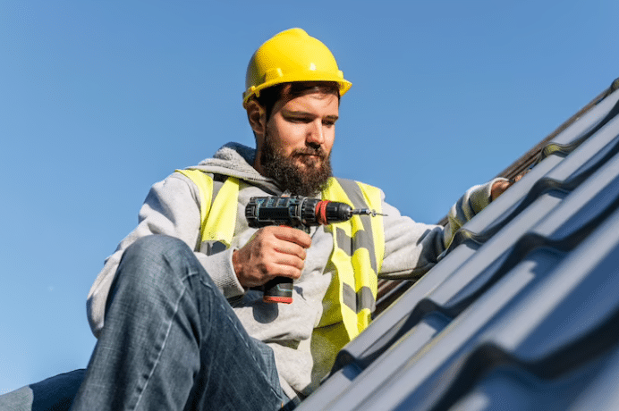 Roofing contractor repairing a roof